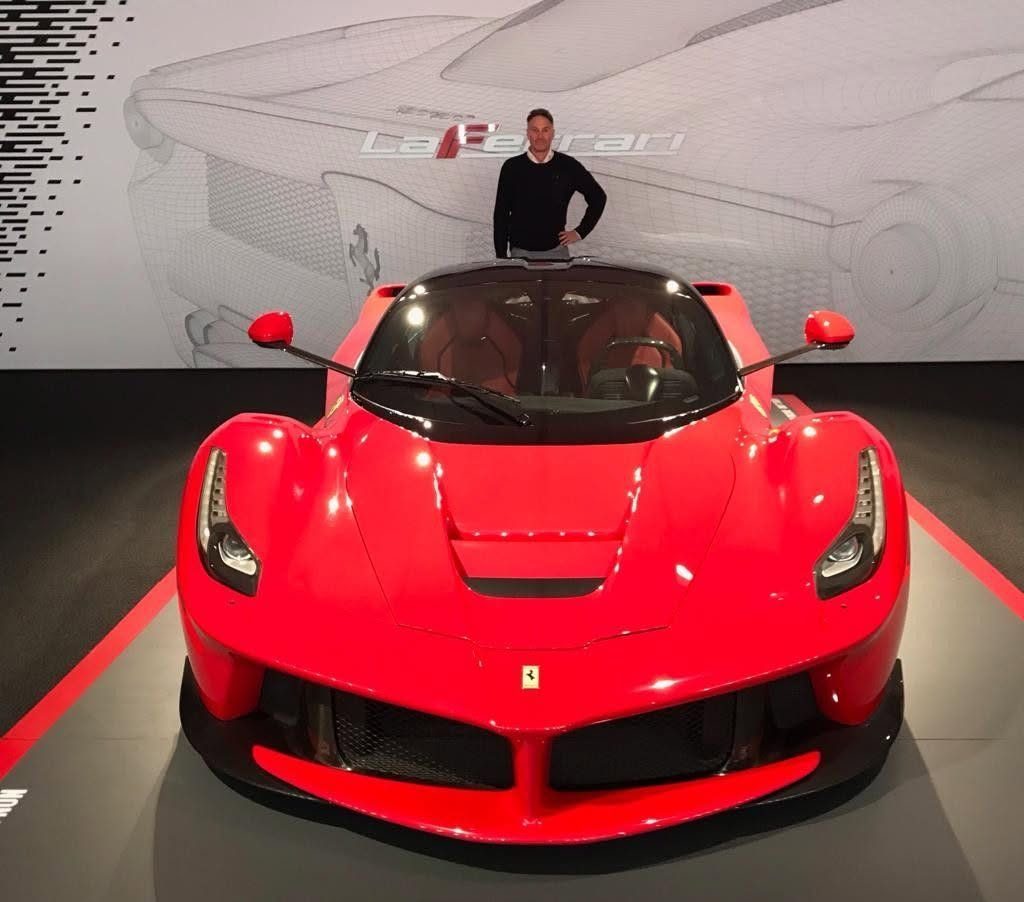 A red Ferrari in a showroom