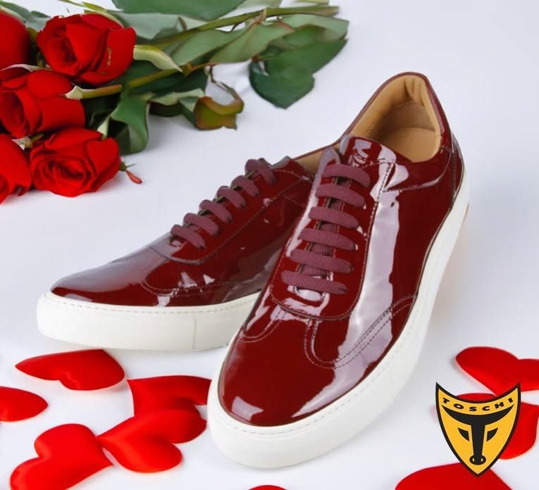 Red patent leather sneaker with roses